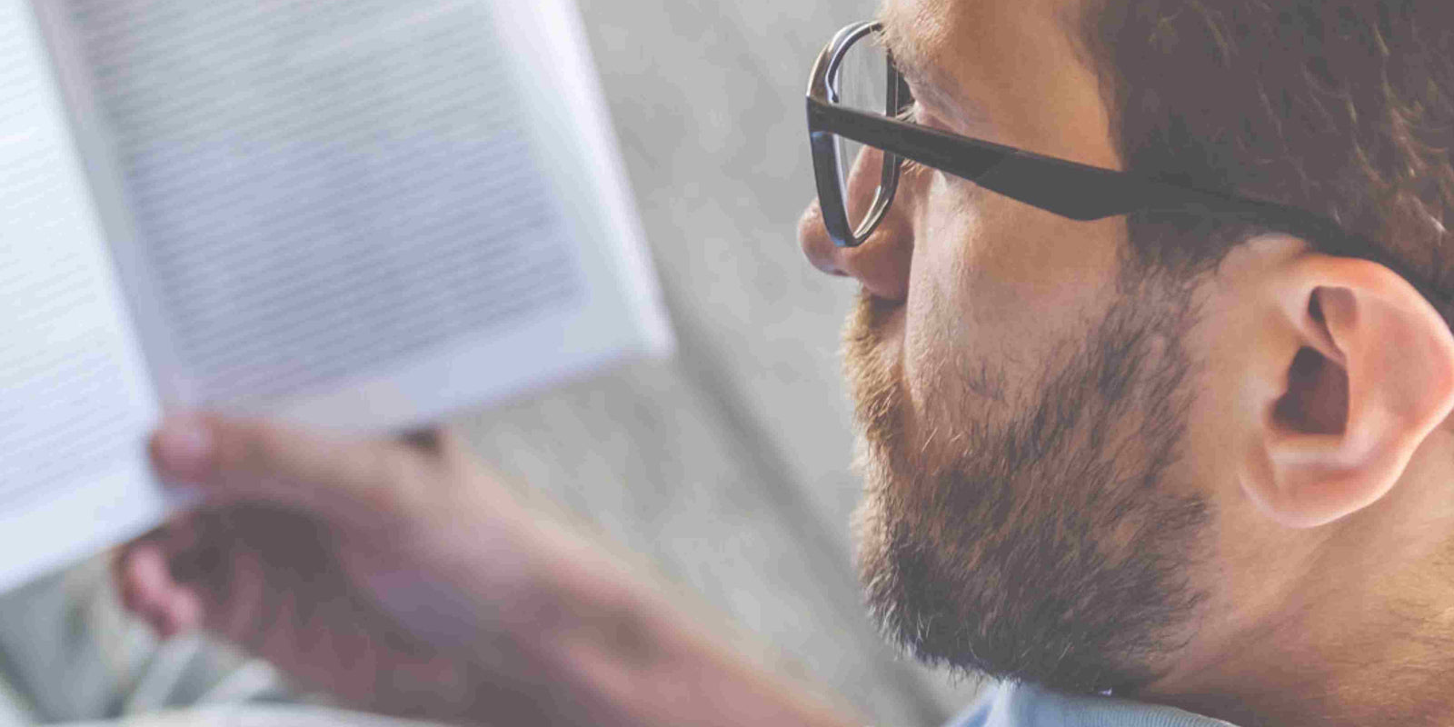 how to read faster: a man reading a book