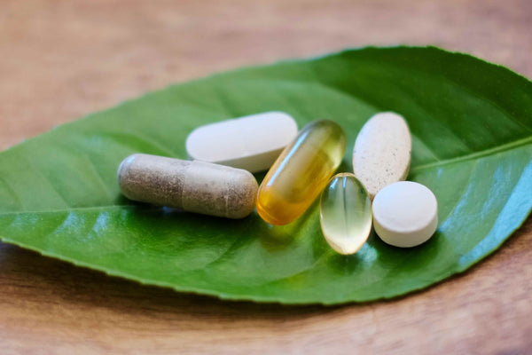 Natural Nootropics: Natural supplements on top of a leaf